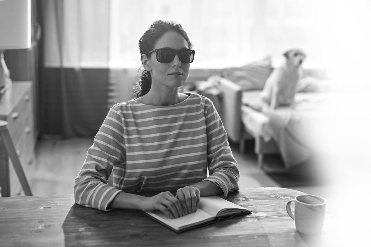 Visually impaired woman reading braille